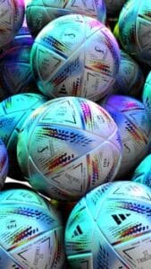 Eye-catching display of vibrant FIFA World Cup soccer balls, highlighting sports equipment details. Tipos de Bolas de Futebol. 