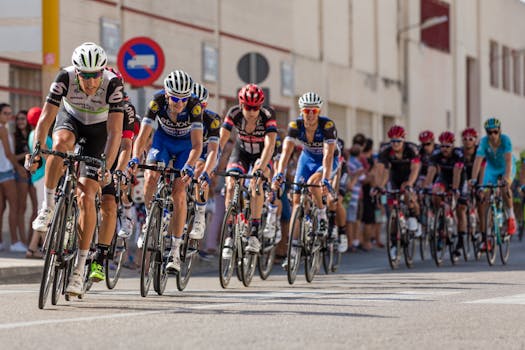 Dynamic photo of professional cyclists racing on a city street, showcasing speed and athleticism. Cycling, Ciclismo.