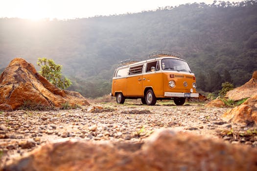 Classic VW van parked on rocky terrain with mountains in Alegría, El Salvador. Trip, Viagem.