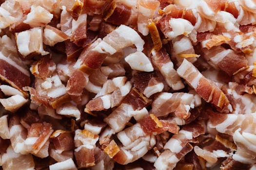 Closeup top view heap of delicious scrumptious pork bellies bacon cut into small slices before cooking process, Fat Burning, Queima de Gordura.