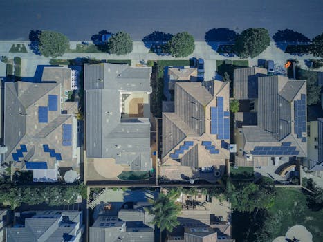 Top-down view of urban houses with solar panels emphasizing clean energy solutions. Future of Homes, Futuro das Casas.