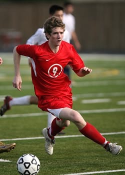 Intense moment during a soccer match with players in action on a grassy field. Soccer, Futebol.