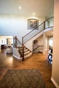 Spacious modern interior showcasing a stylish wooden staircase and elegant decor. Home, casa. 