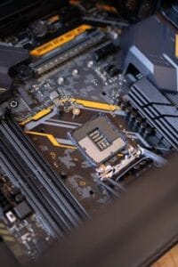 Detailed view of a computer motherboard highlighting electronic components and technology connections. Technology, Tecnologia.