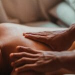 A soothing back massage session in a spa setting, focusing on wellness and relaxation. Nuru massage, Massagem Nuru.