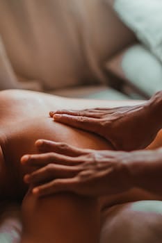 A soothing back massage session in a spa setting, focusing on wellness and relaxation. Nuru massage, Massagem Nuru.