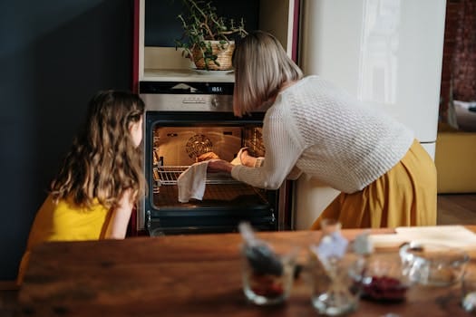 A mother and daughter baking a cake in a cozy kitchen setting, enhancing family time. Creative Recipes, Receitas Criativas.