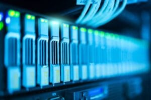 Detailed image of a server rack with glowing lights in a modern data center. Technology, Tecnologia. 