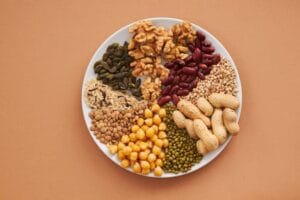 Top view of nuts, beans, and seeds on a plate, ideal for healthy dining themes. Health and grains, saúde. 